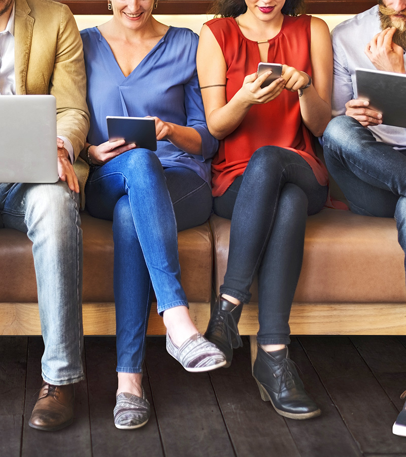 Three people rading the MCode For Students email newsletter on different devices