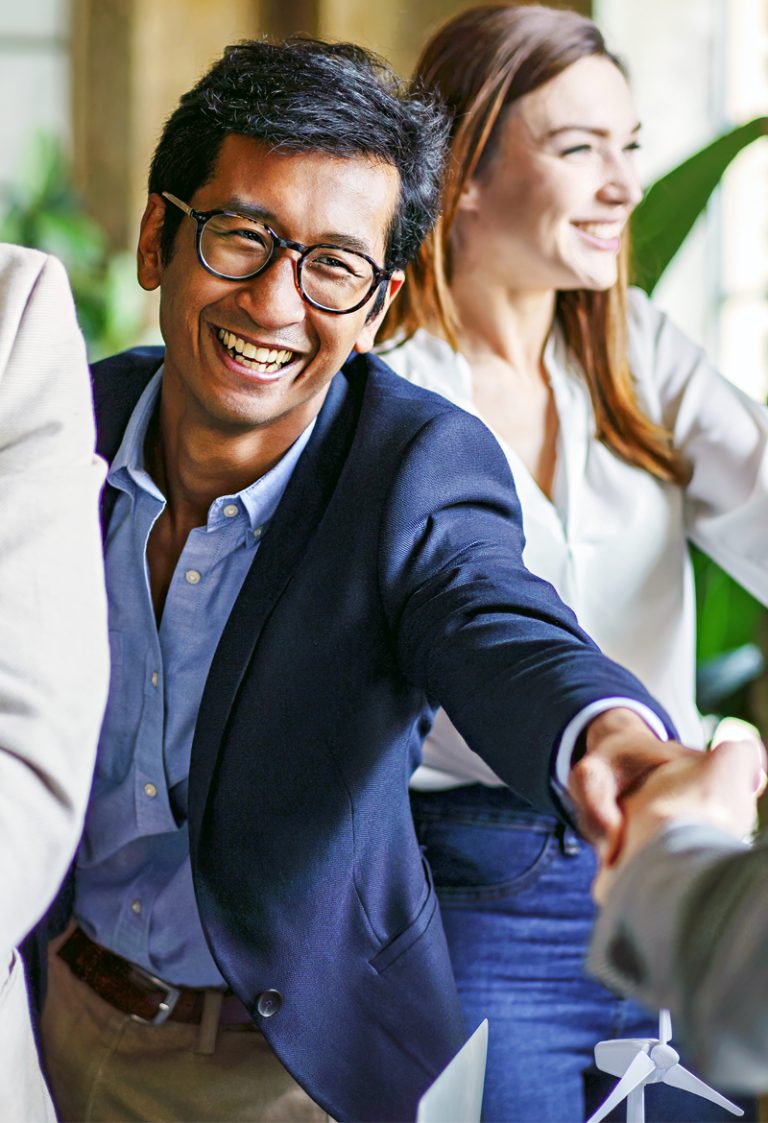 ministry-certification-for-coaches-internal-leaders-img Asian male MCode For Ministry Certified Coach shaking hands with a church pastor
