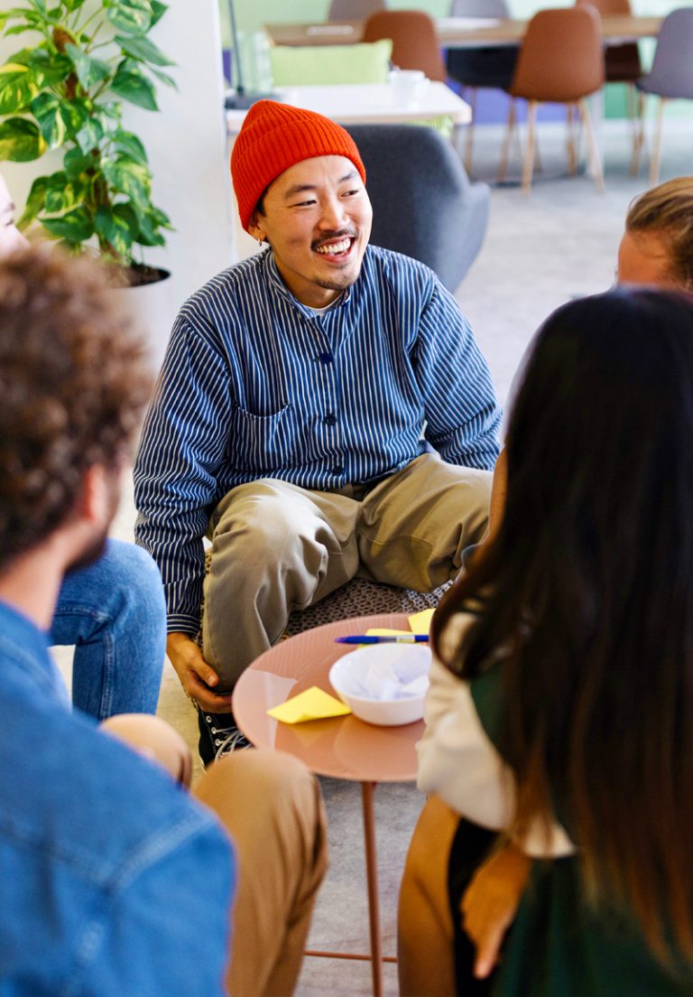 people-problems-in-ministry-img An Asian man in a bright red beanie goofing off and causing problems in his church ministry team